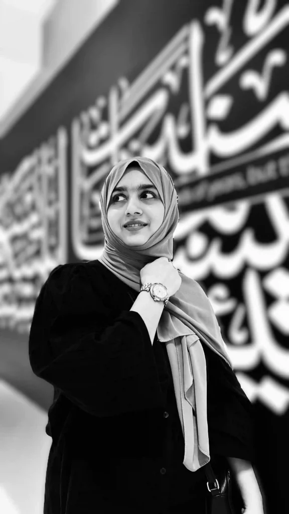 A professional women in hijab looking upward